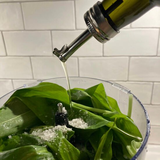 Food processor with wild garlic, oil and salt